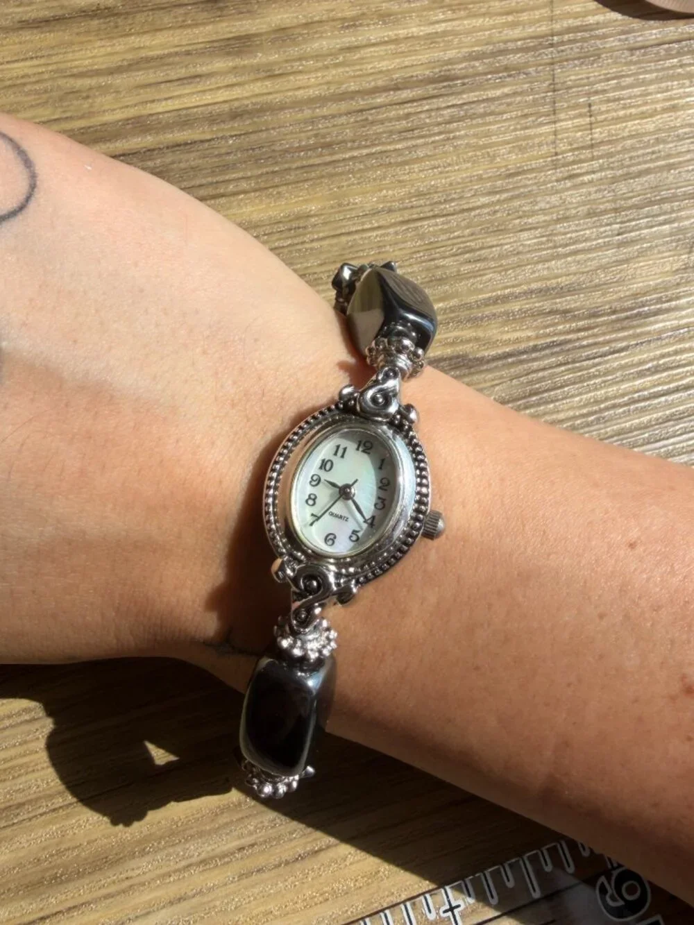 vintage geneva black and silver beaded with mother of pearl face watch OS